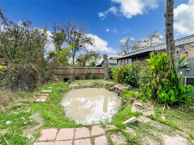 a bathroom with a tub and shower