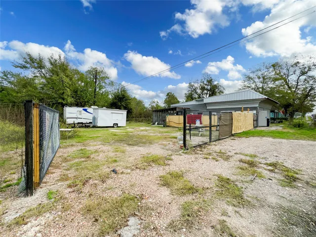 an aerial view of a house with swimming pool and porch