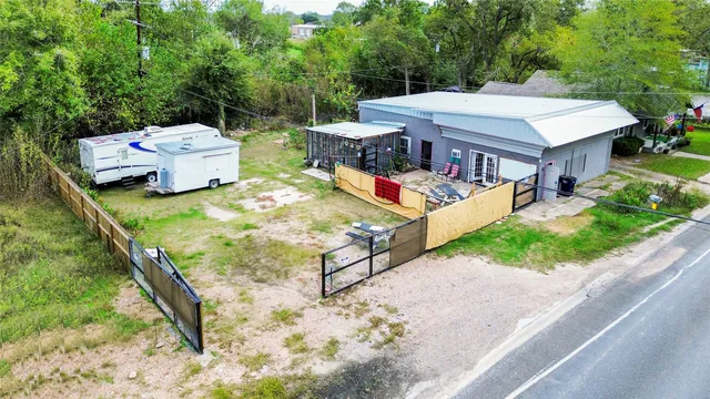 an aerial view of a house with garden space and sitting space