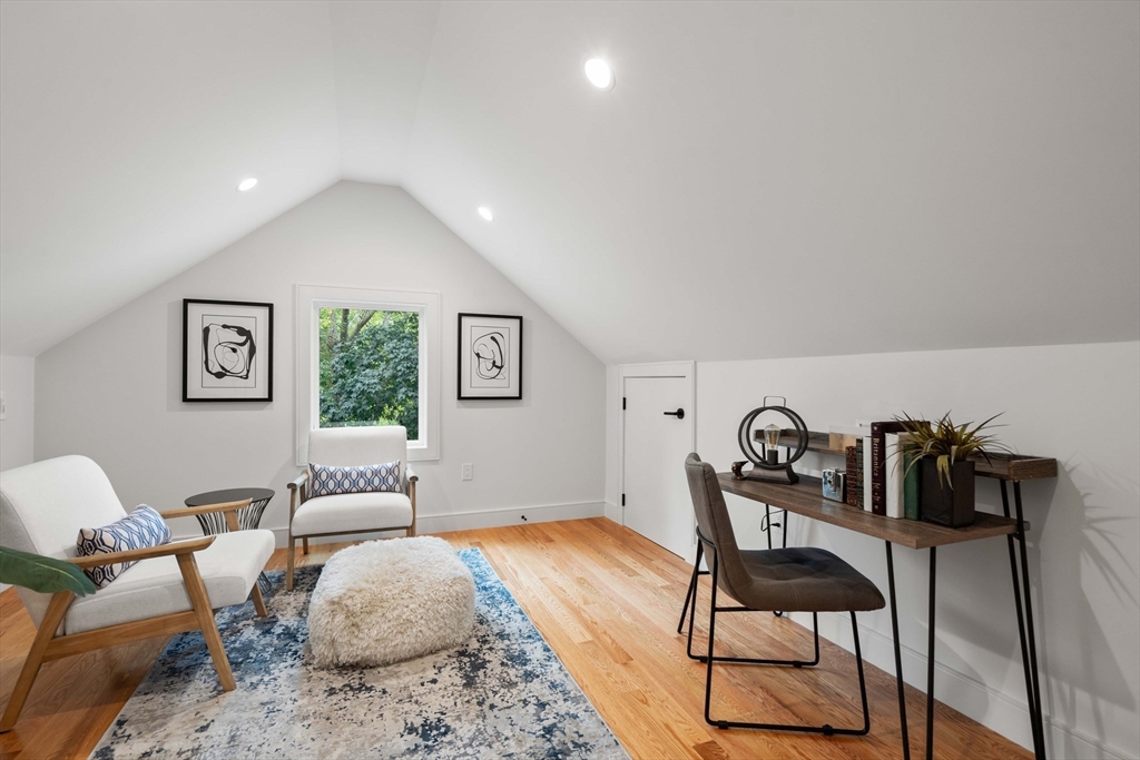 110 Harvard Street, Unit A Newton, MA 02460 - Photo 22 of 30 a bedroom with furniture and a wooden floor
