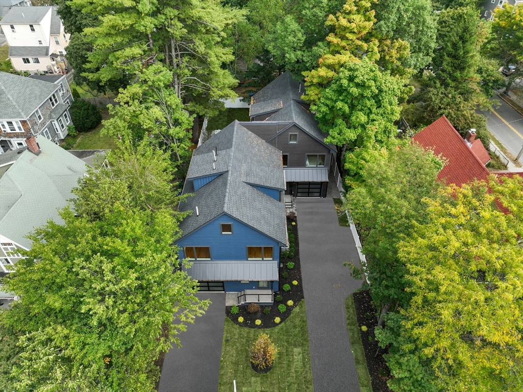 110 Harvard Street, Unit A Newton, MA 02460 - Photo 30 of 30 an aerial view of a house with a yard and large trees