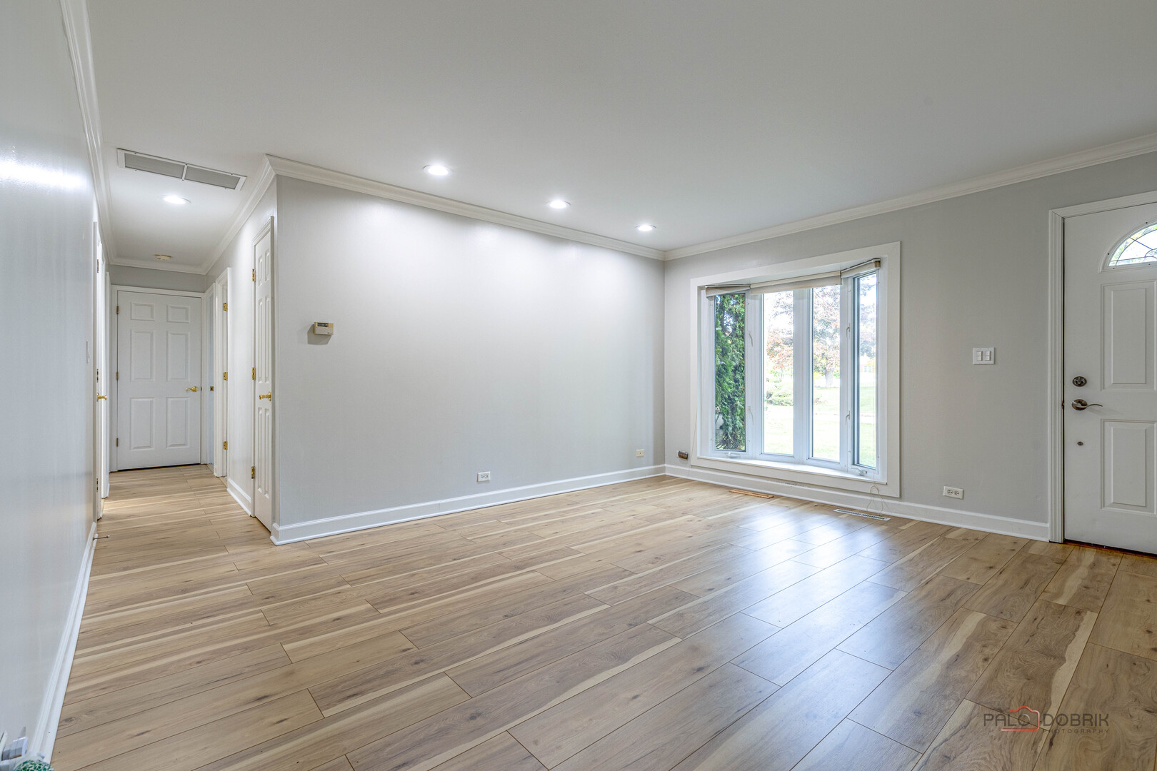 533 Cherry Lane Glenview, IL 60025 - Photo 11 of 33 a view of an empty room with wooden floor and a window