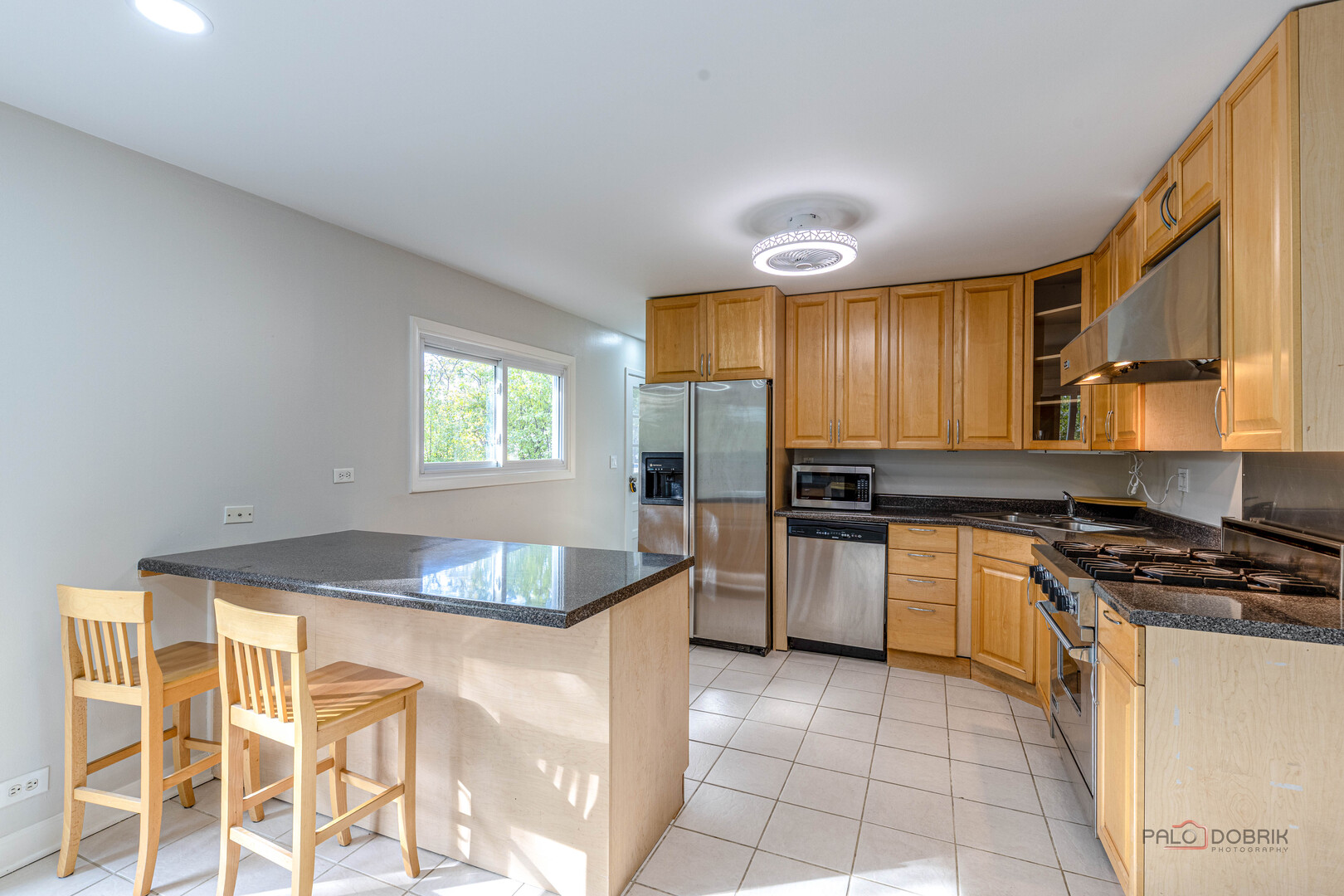 533 Cherry Lane Glenview, IL 60025 - Photo 17 of 33 a kitchen with granite countertop cabinets stainless steel appliances and a counter space