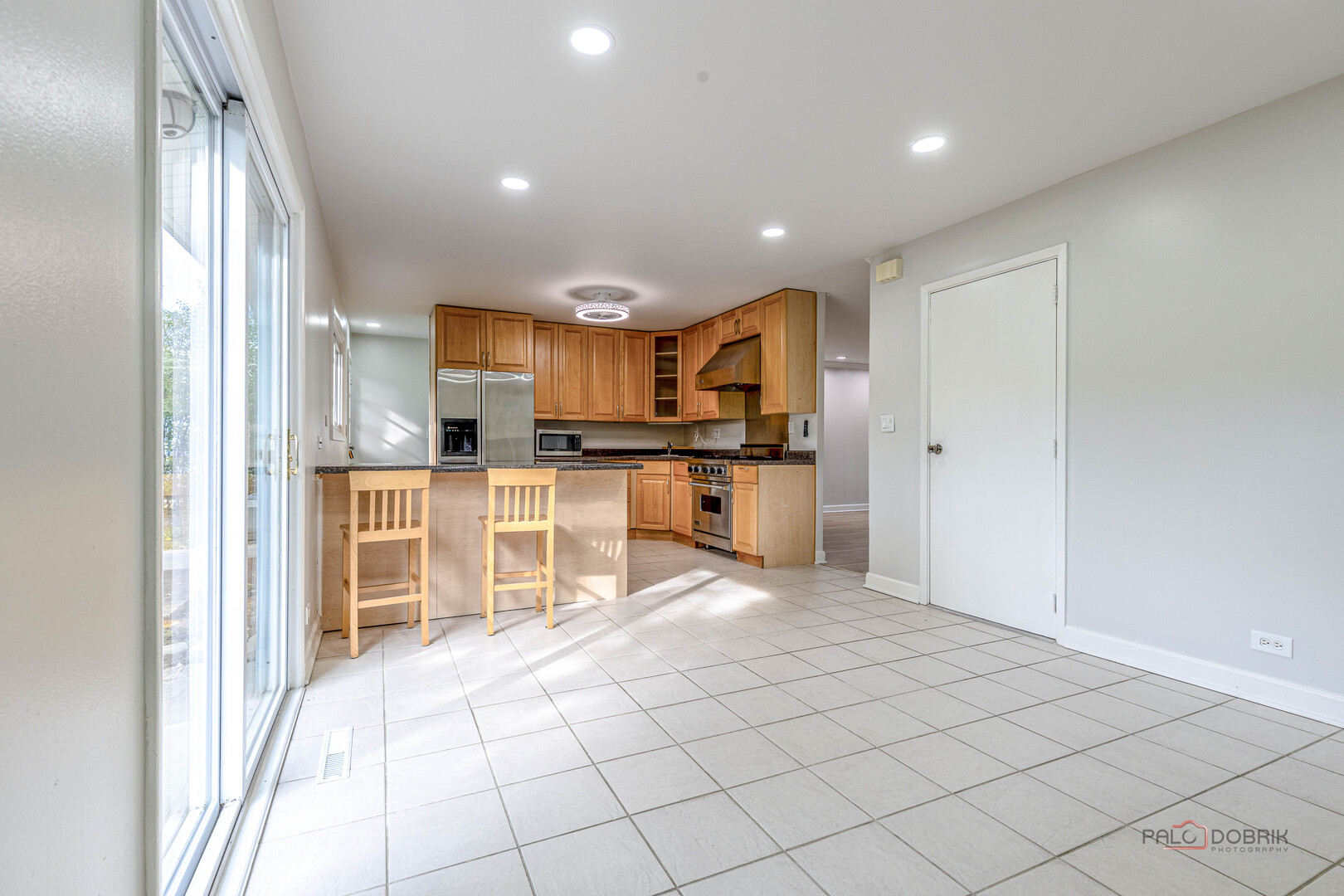 533 Cherry Lane Glenview, IL 60025 - Photo 18 of 33 a view of kitchen with kitchen island granite countertop a refrigerator and a sink