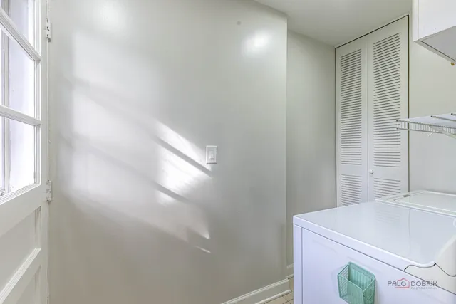 a bathroom with a tub and shower