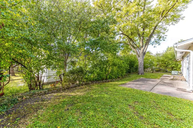 a view of outdoor space with deck and yard
