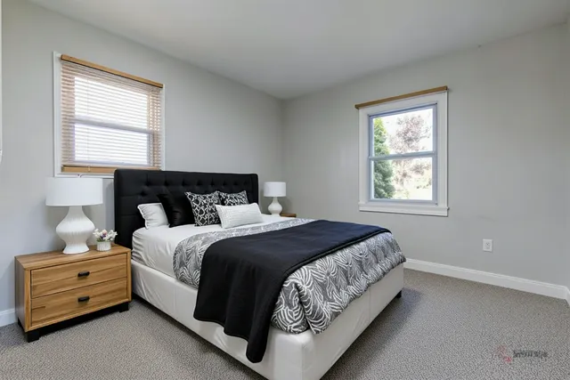 a bedroom with a bed and window