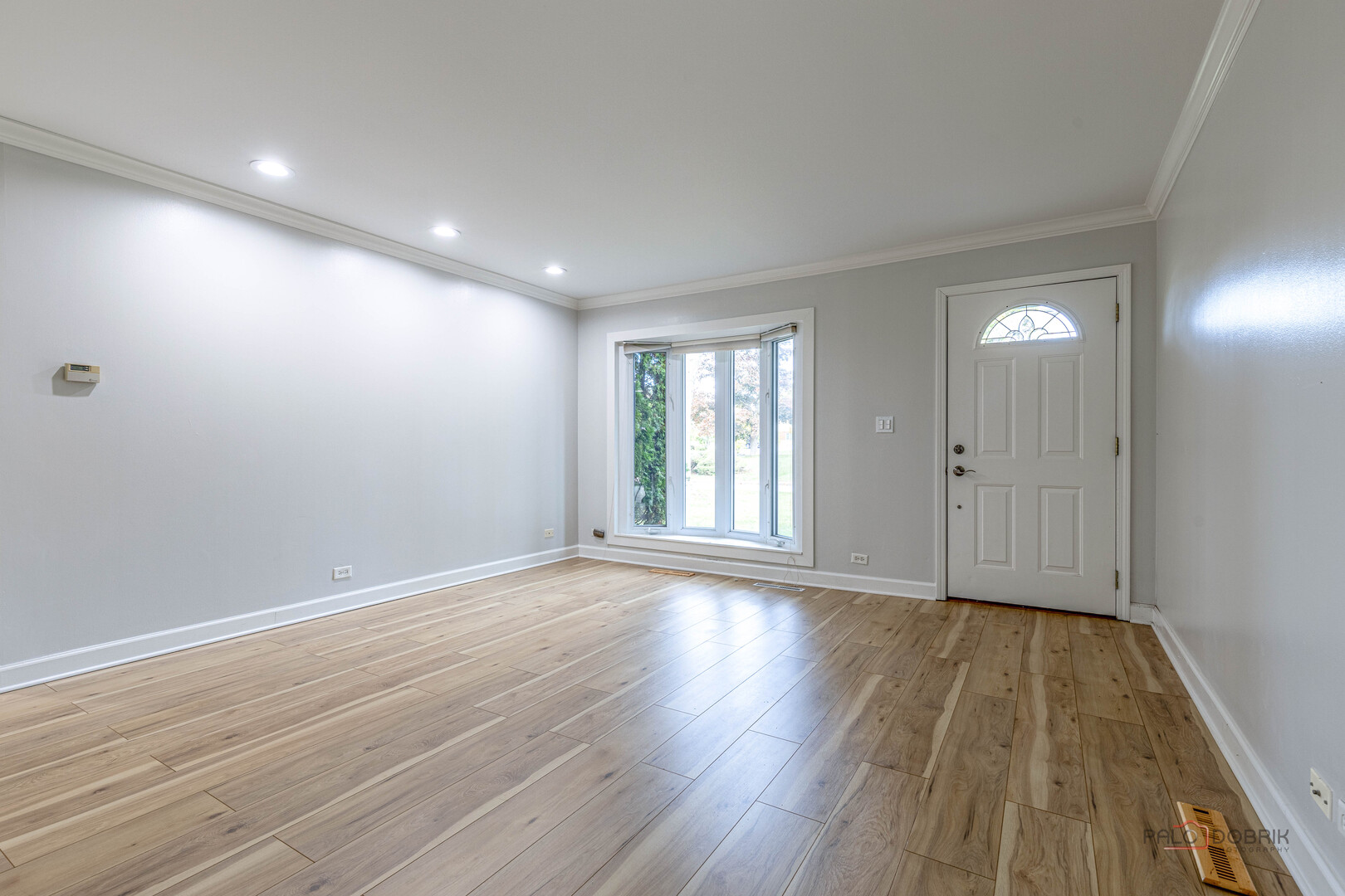 533 Cherry Lane Glenview, IL 60025 - Photo 10 of 33 a view of an empty room with wooden floor and a window