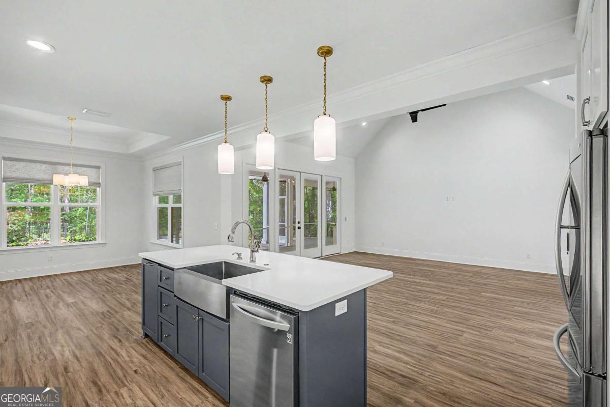 656 Sanderling Trace Waverly, GA 31565 - Photo 16 of 71 a kitchen with a sink and wooden floor