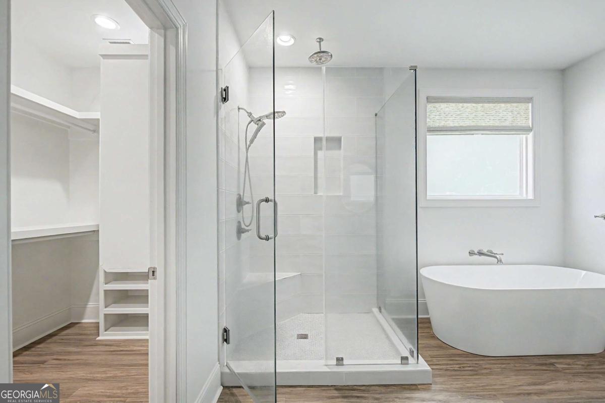 656 Sanderling Trace Waverly, GA 31565 - Photo 22 of 71 a bathroom with a bathtub and a shower