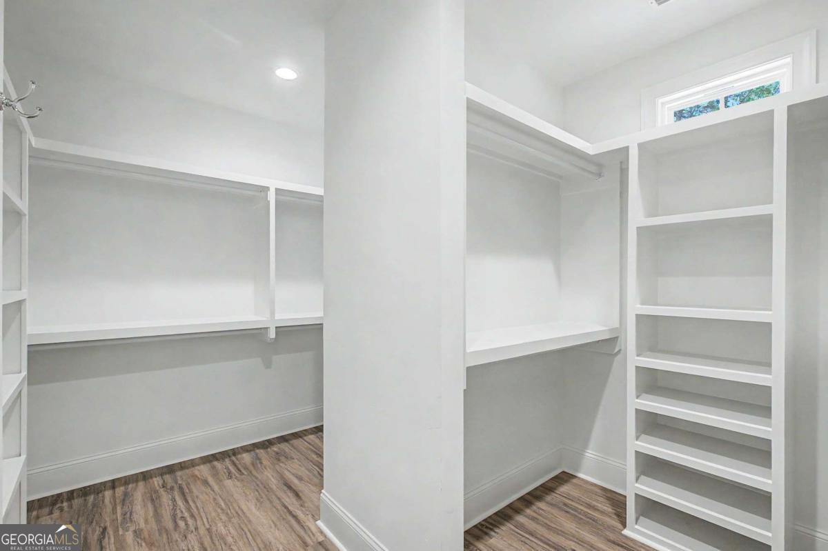 656 Sanderling Trace Waverly, GA 31565 - Photo 24 of 71 a view of walk in closet with empty racks