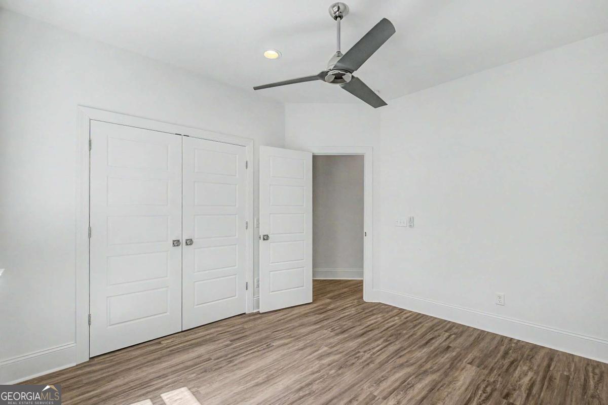 656 Sanderling Trace Waverly, GA 31565 - Photo 25 of 71 a view of empty room with wooden floor