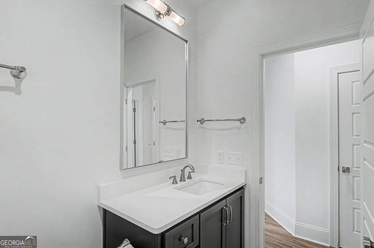 656 Sanderling Trace Waverly, GA 31565 - Photo 28 of 71 a bathroom with a sink and a mirror