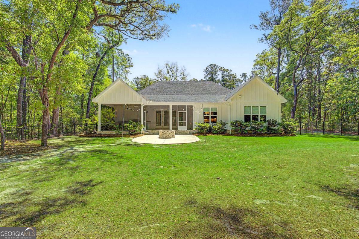 656 Sanderling Trace Waverly, GA 31565 - Photo 37 of 71 a front view of a house with garden