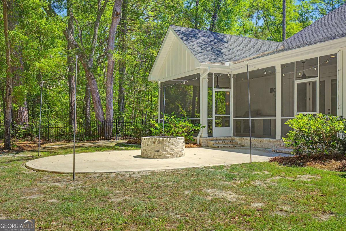656 Sanderling Trace Waverly, GA 31565 - Photo 39 of 71 a view of a house with backyard and sitting area