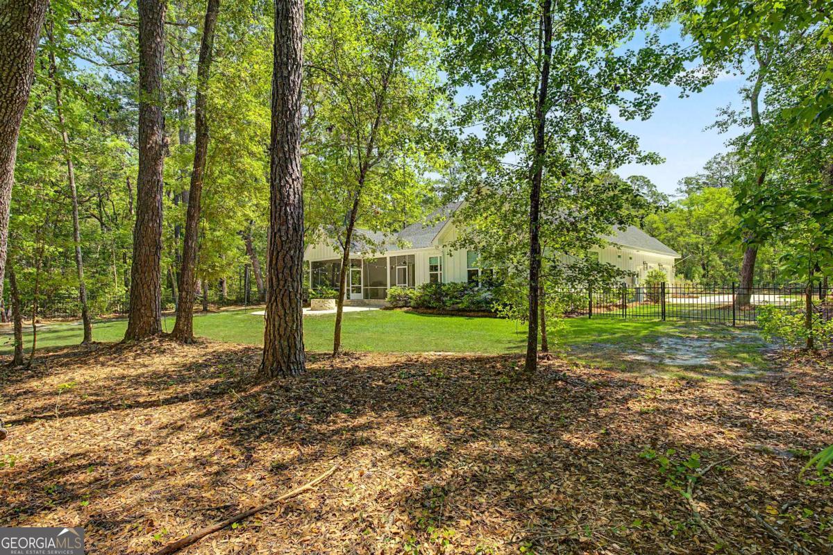 656 Sanderling Trace Waverly, GA 31565 - Photo 41 of 71 a view of a house with a backyard