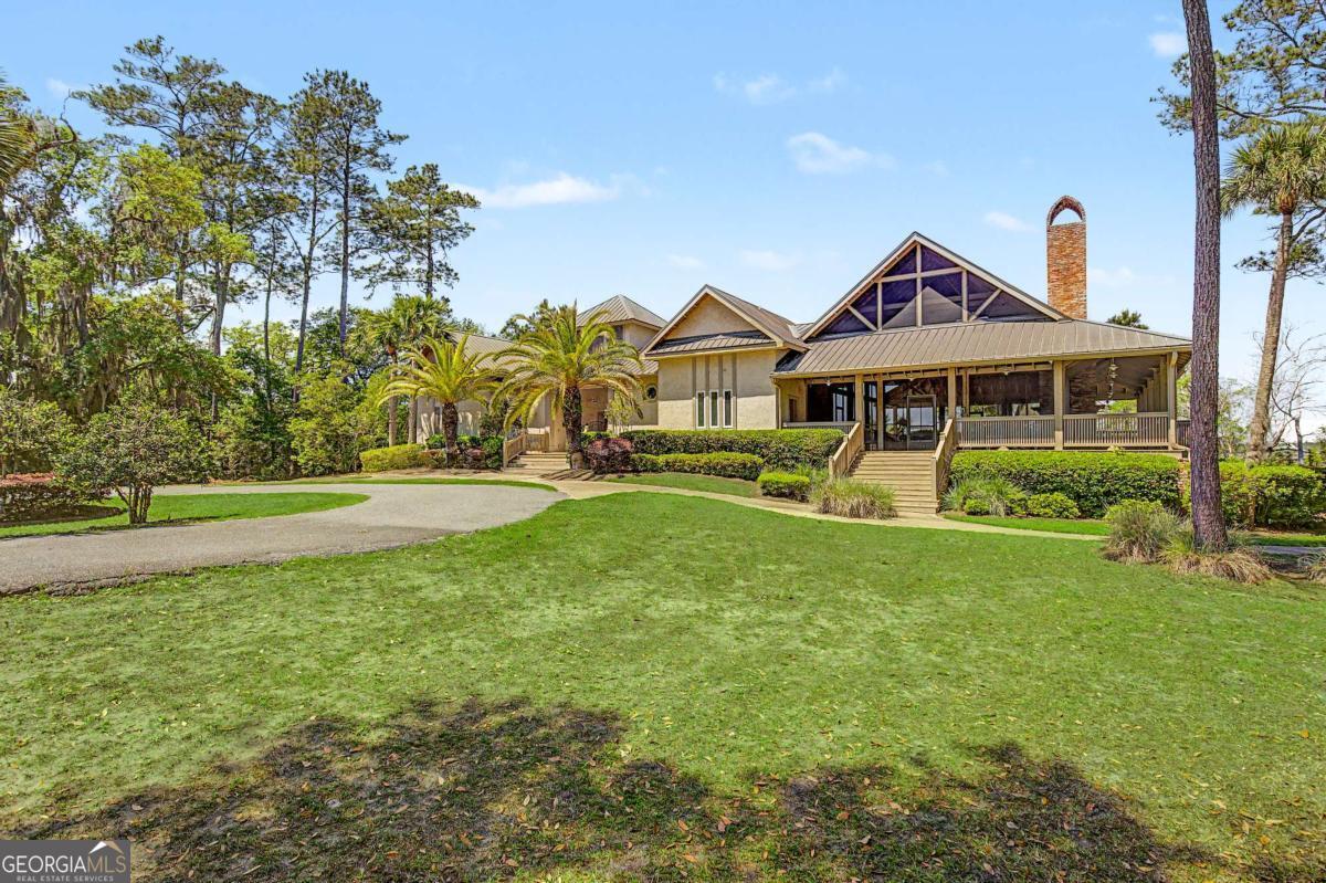 656 Sanderling Trace Waverly, GA 31565 - Photo 45 of 71 a front view of a house with a yard