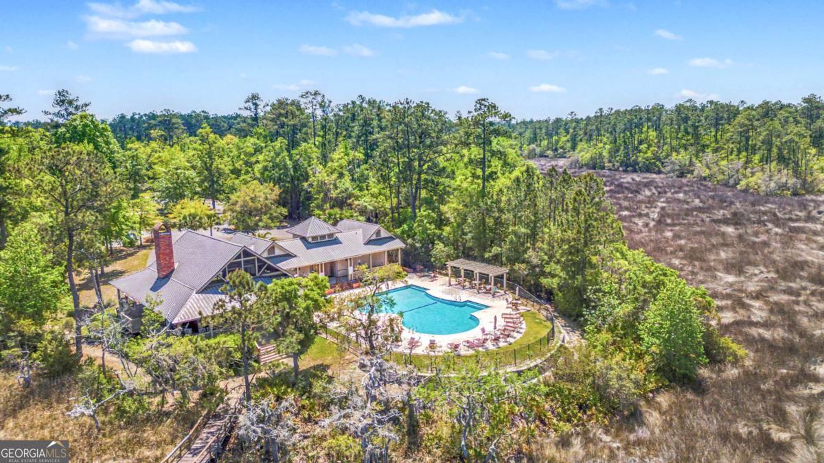 656 Sanderling Trace Waverly, GA 31565 - Photo 48 of 71 an aerial view of a house with yard swimming pool and outdoor seating