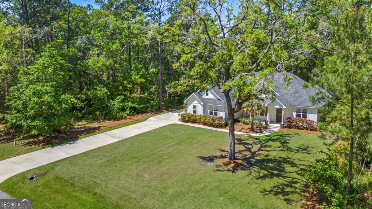 656 Sanderling Trace Waverly, GA 31565 - Photo 67 of 71 a front view of a house with a yard