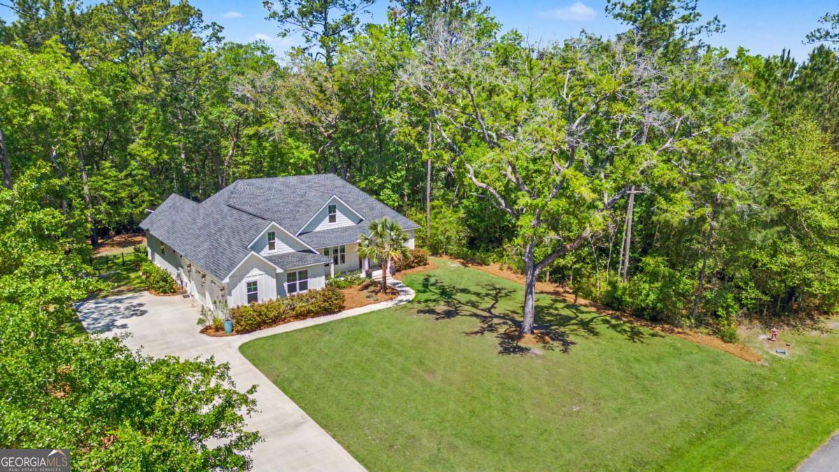 656 Sanderling Trace Waverly, GA 31565 - Photo 68 of 71 an aerial view of a house with garden space and street view