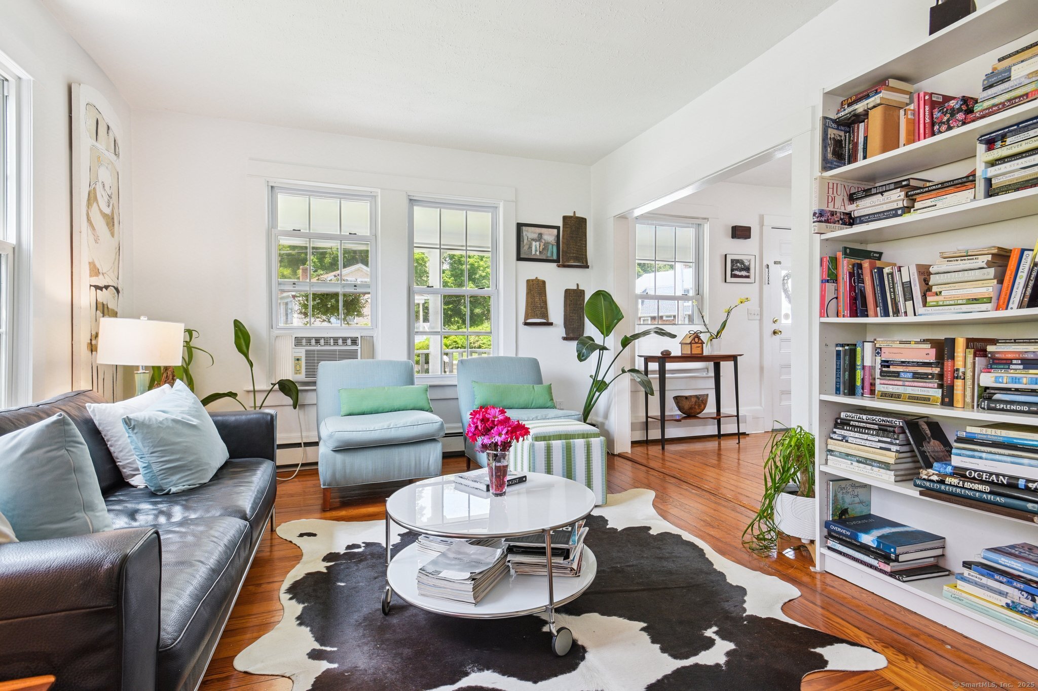24 Warren Avenue Mystic, CT 06355 - Photo 11 of 37 a living room with furniture and a book shelf