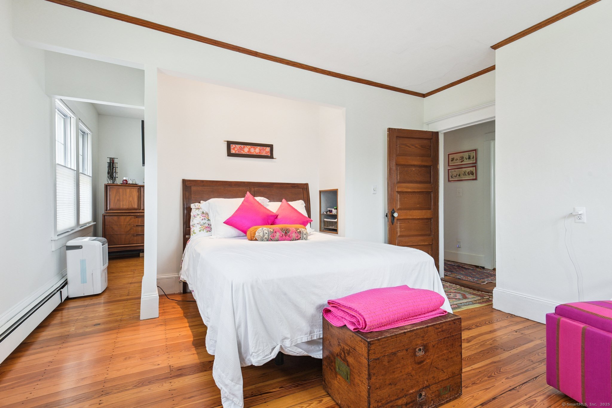 24 Warren Avenue Mystic, CT 06355 - Photo 18 of 37 a bedroom with a bed and wooden floor