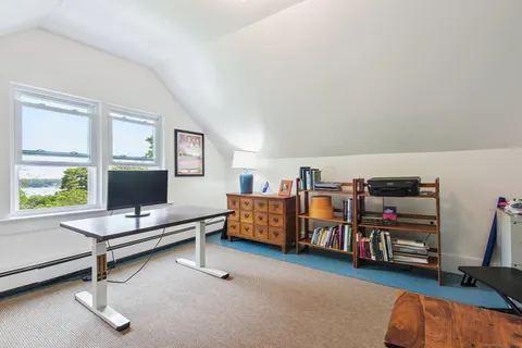 a living room with lots of furniture and a wooden floor