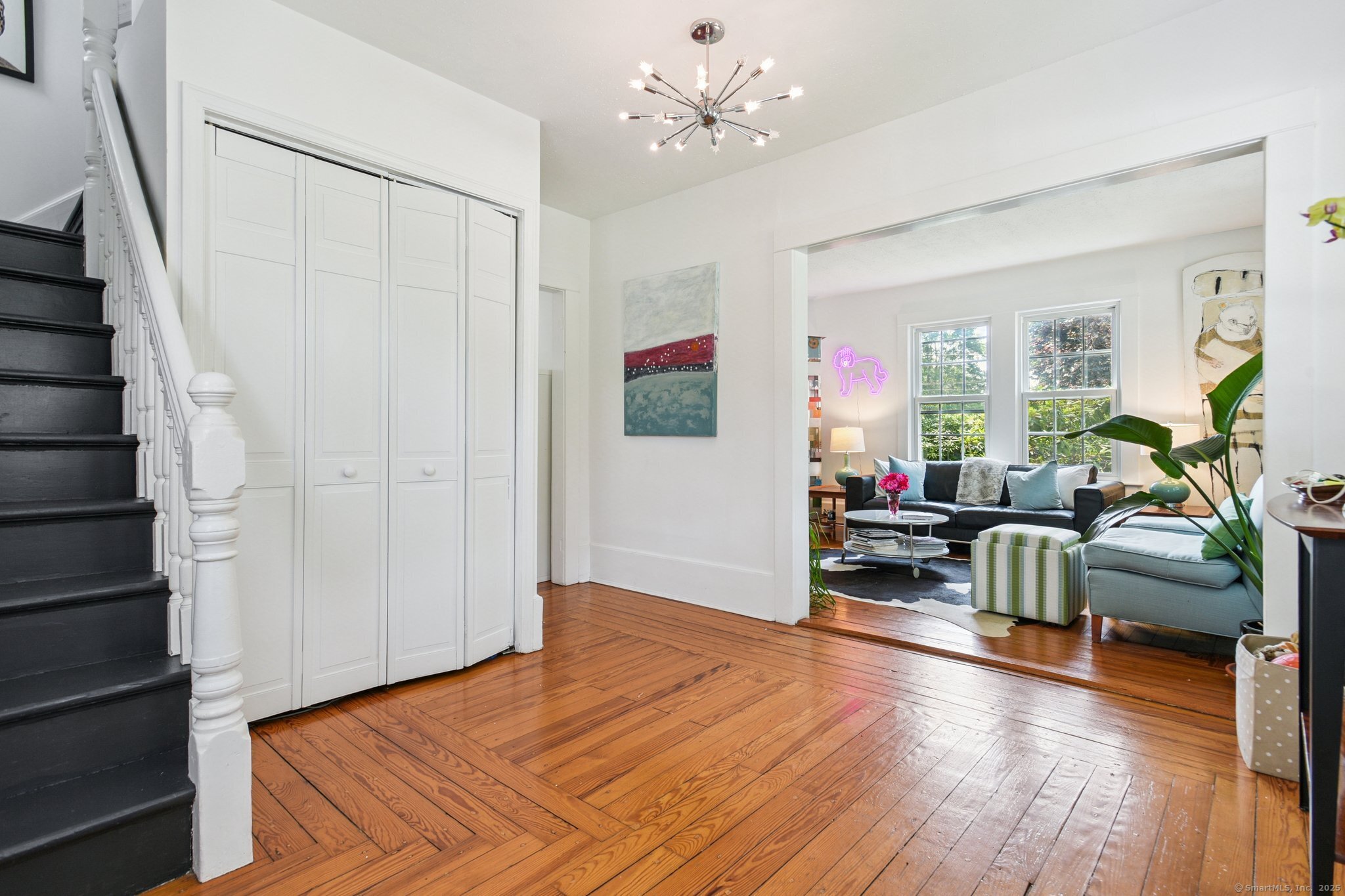 24 Warren Avenue Mystic, CT 06355 - Photo 4 of 37 a bedroom with furniture and a wooden floor