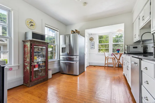 a kitchen with stainless steel appliances a refrigerator and a sink
