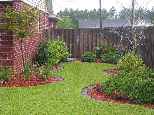 6310 Billoree Road Pace, FL 32571 - Photo 12 of 15 BRCK PAVERS AROUND THE FLOWER BEDS