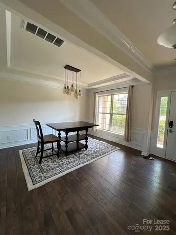 a living room with couch table and a window