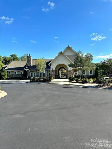 a view of a terrace with wooden floor and a yard