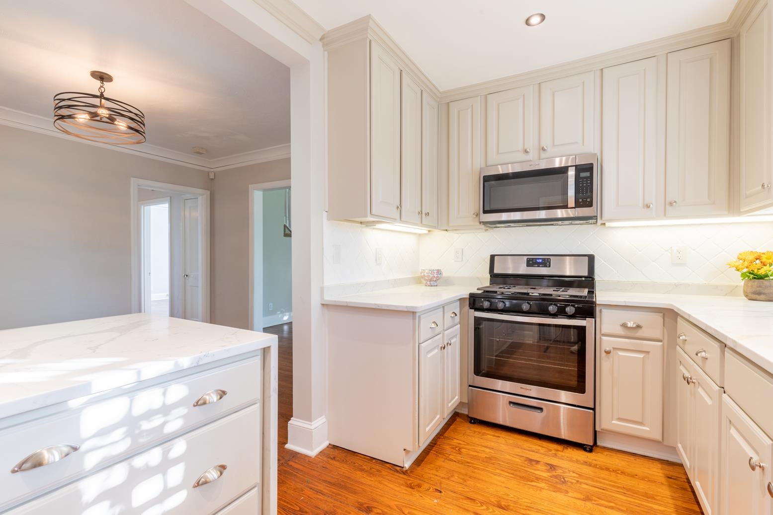 380 Holmes Circle Memphis, TN 38111 - Photo 14 of 22 a kitchen with stainless steel appliances a stove a microwave and sink
