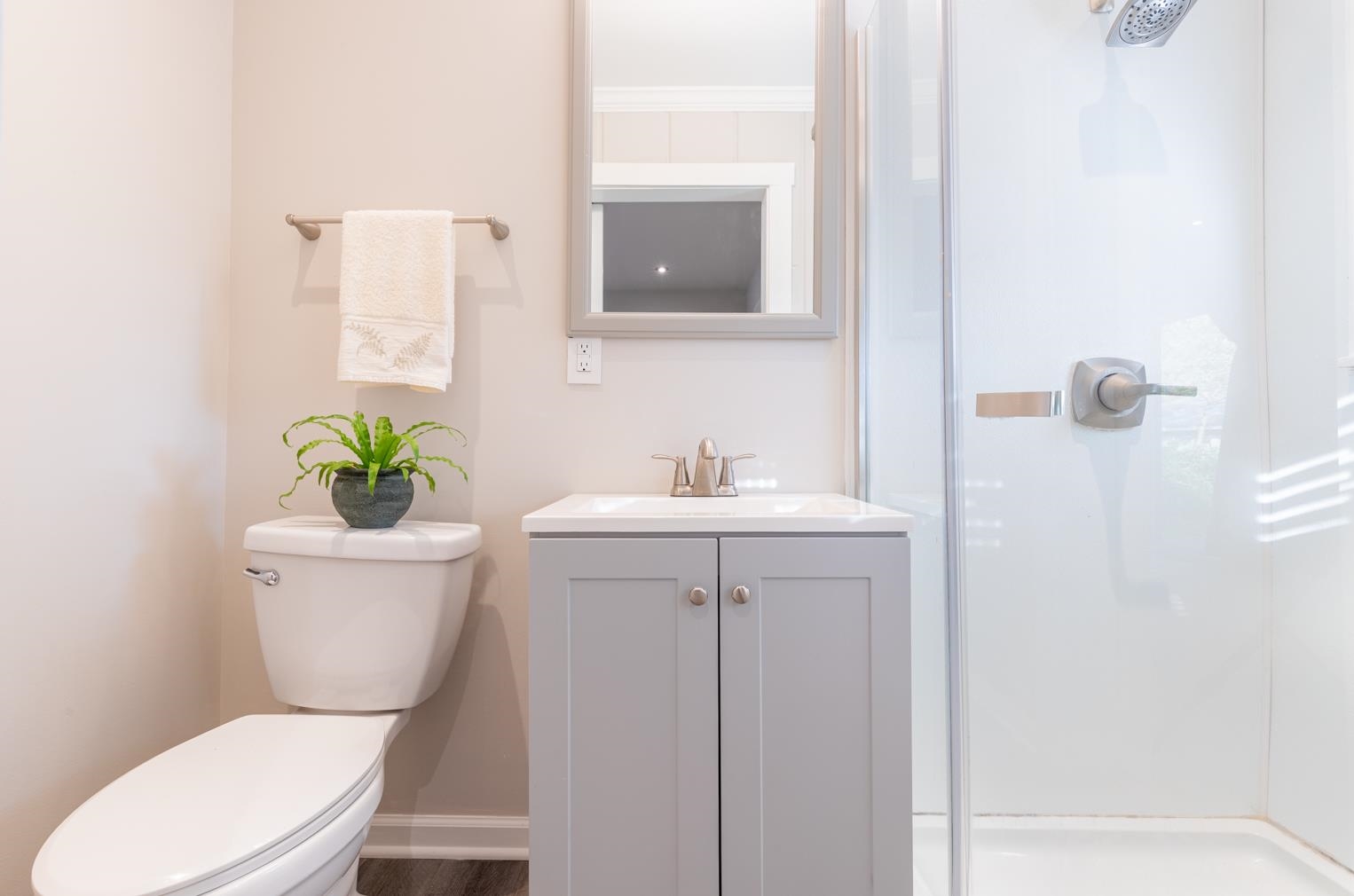 380 Holmes Circle Memphis, TN 38111 - Photo 16 of 22 a white toilet sitting next to a bathroom sink