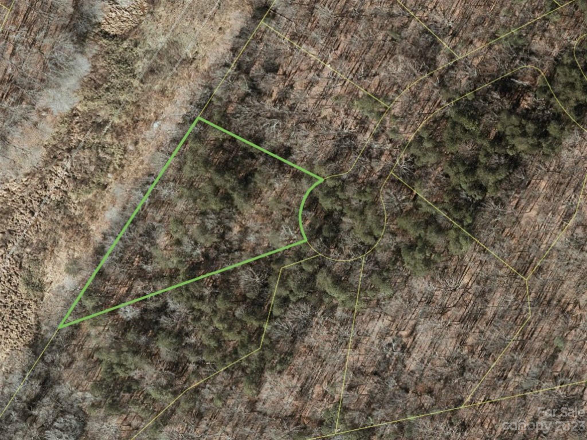 156 Copper Pne Lane, Unit 5 Davidson, NC 28036 - Photo 6 of 21 a view of a dry yard with wooden fence and basketball court
