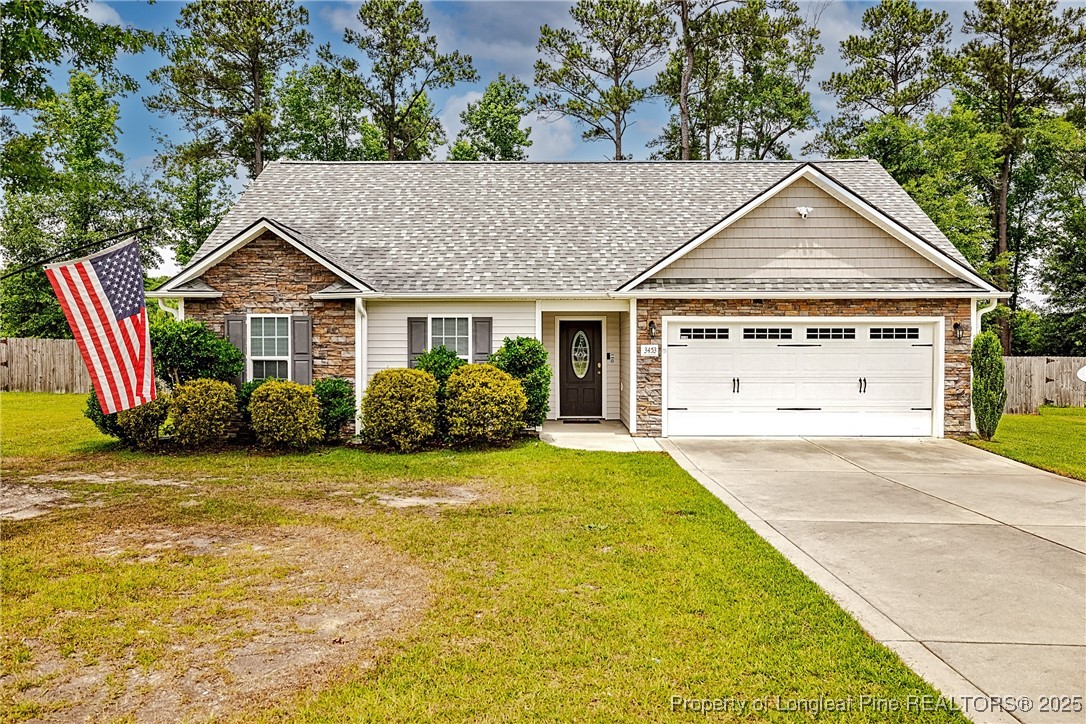 3453 Thrower Road Hope Mills, NC 28348 - Photo 1 of 24 a view of a house with a yard and plants