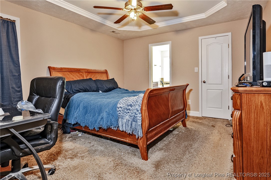 3453 Thrower Road Hope Mills, NC 28348 - Photo 13 of 24 a bedroom with a bed and wooden floor