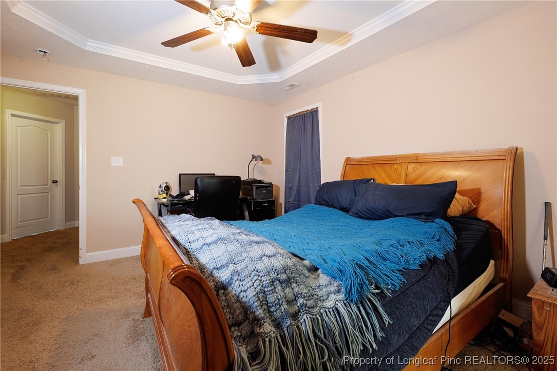 3453 Thrower Road Hope Mills, NC 28348 - Photo 14 of 24 a bedroom with a bed and a dresser