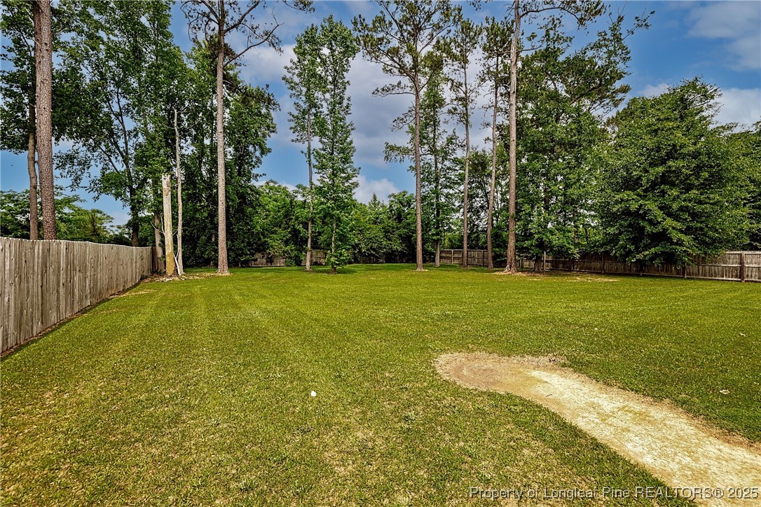 3453 Thrower Road Hope Mills, NC 28348 - Photo 22 of 24 a swimming pool with wooden fence
