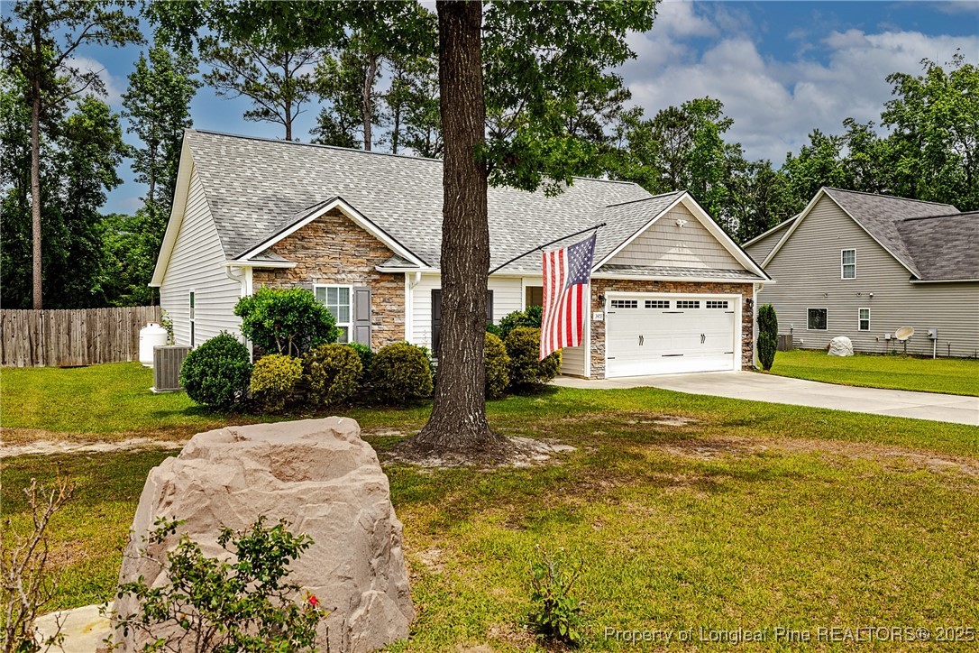 3453 Thrower Road Hope Mills, NC 28348 - Photo 3 of 24 a front view of a house with garden
