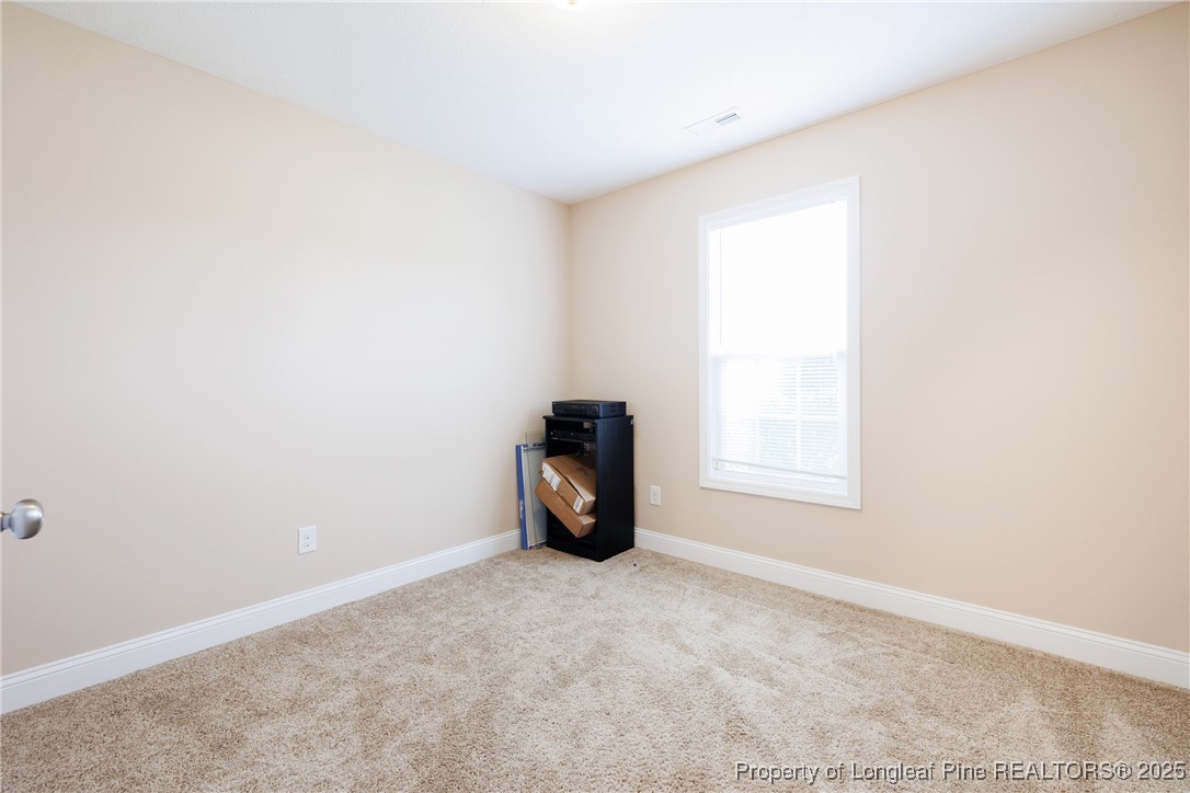 3453 Thrower Road Hope Mills, NC 28348 - Photo 8 of 24 an empty room with a window