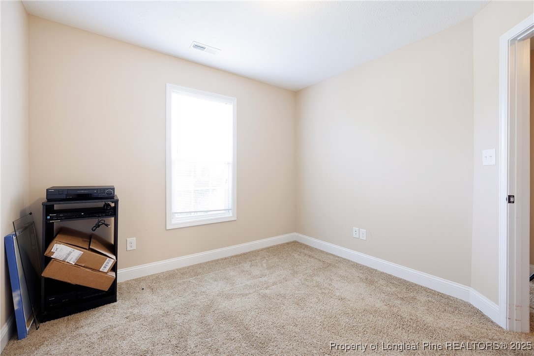 3453 Thrower Road Hope Mills, NC 28348 - Photo 9 of 24 an empty room with a window