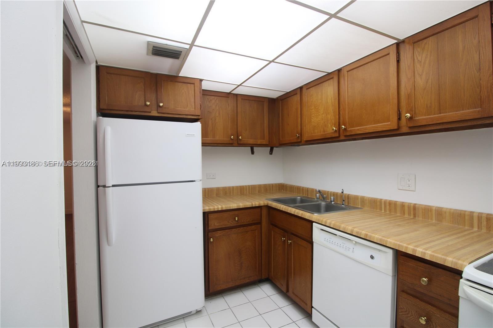 3690 Inverrary Drive, Unit 3A Lauderhill, FL 33319 - Photo 7 of 18 a utility room with dryer and washer