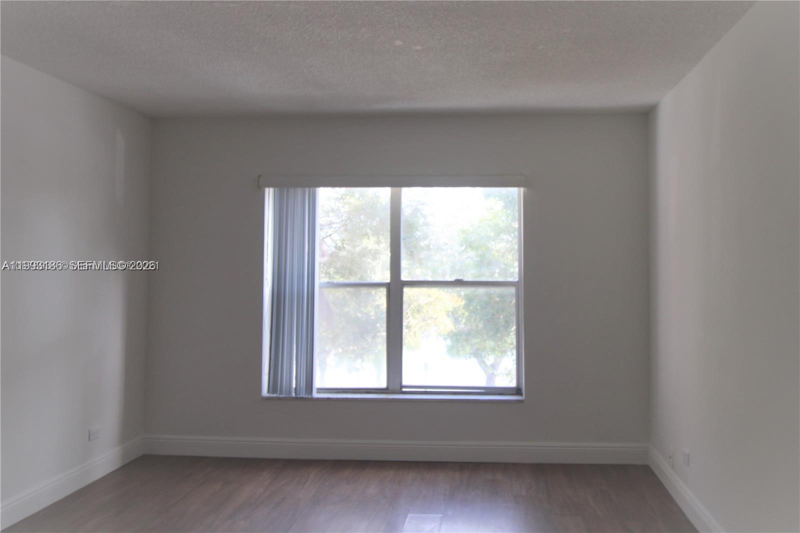 3690 Inverrary Drive, Unit 3A Lauderhill, FL 33319 - Photo 9 of 18 an empty room with a window