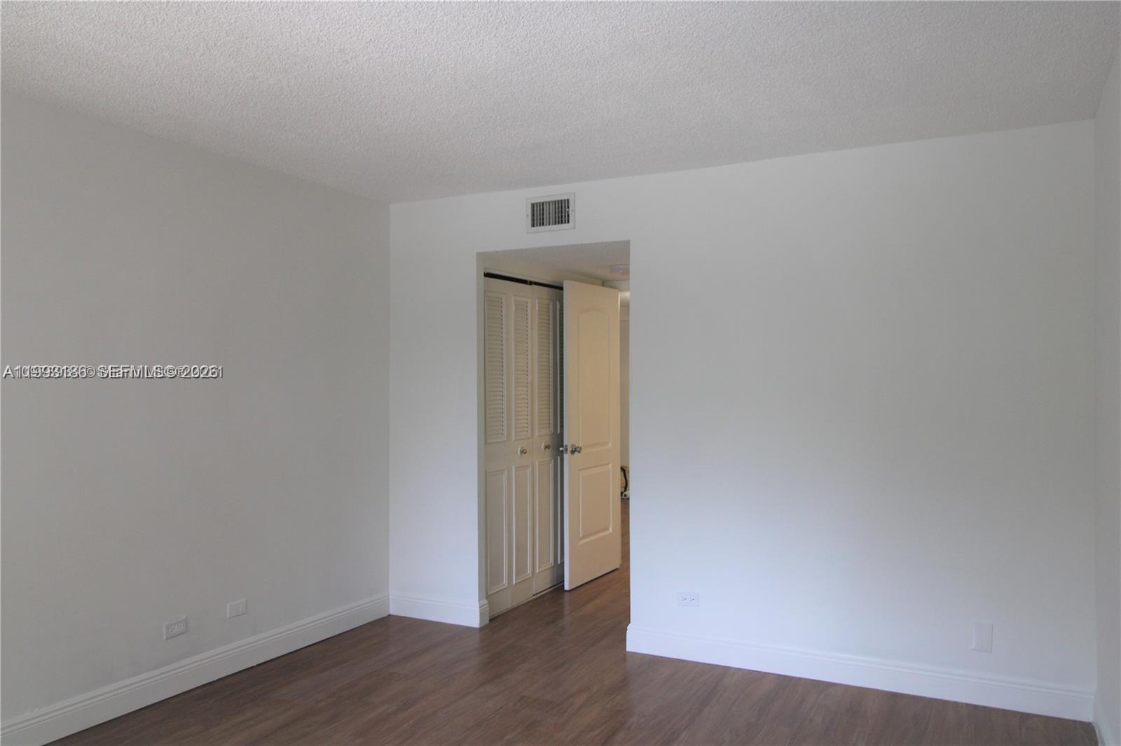 3690 Inverrary Drive, Unit 3A Lauderhill, FL 33319 - Photo 10 of 18 a view of an entryway with wooden floor