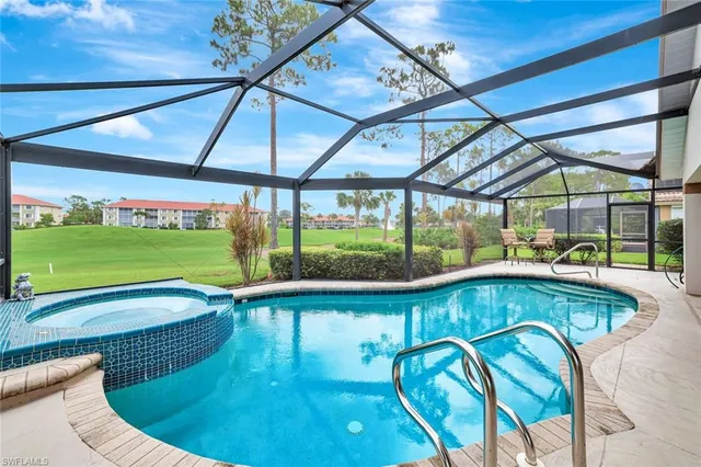 a view of swimming pool with seating area and furniture