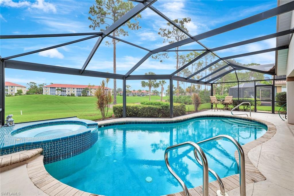 5859 Westbourgh Court Naples, FL 34112 - Photo 1 of 25 a view of swimming pool with seating area and furniture