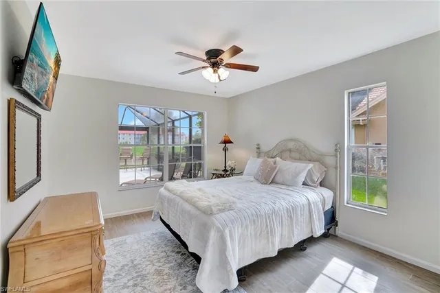 a bedroom with a bed couch and window