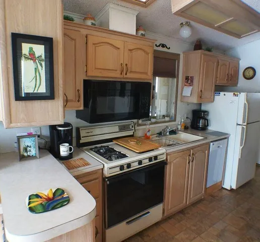 a kitchen with a stove and a microwave