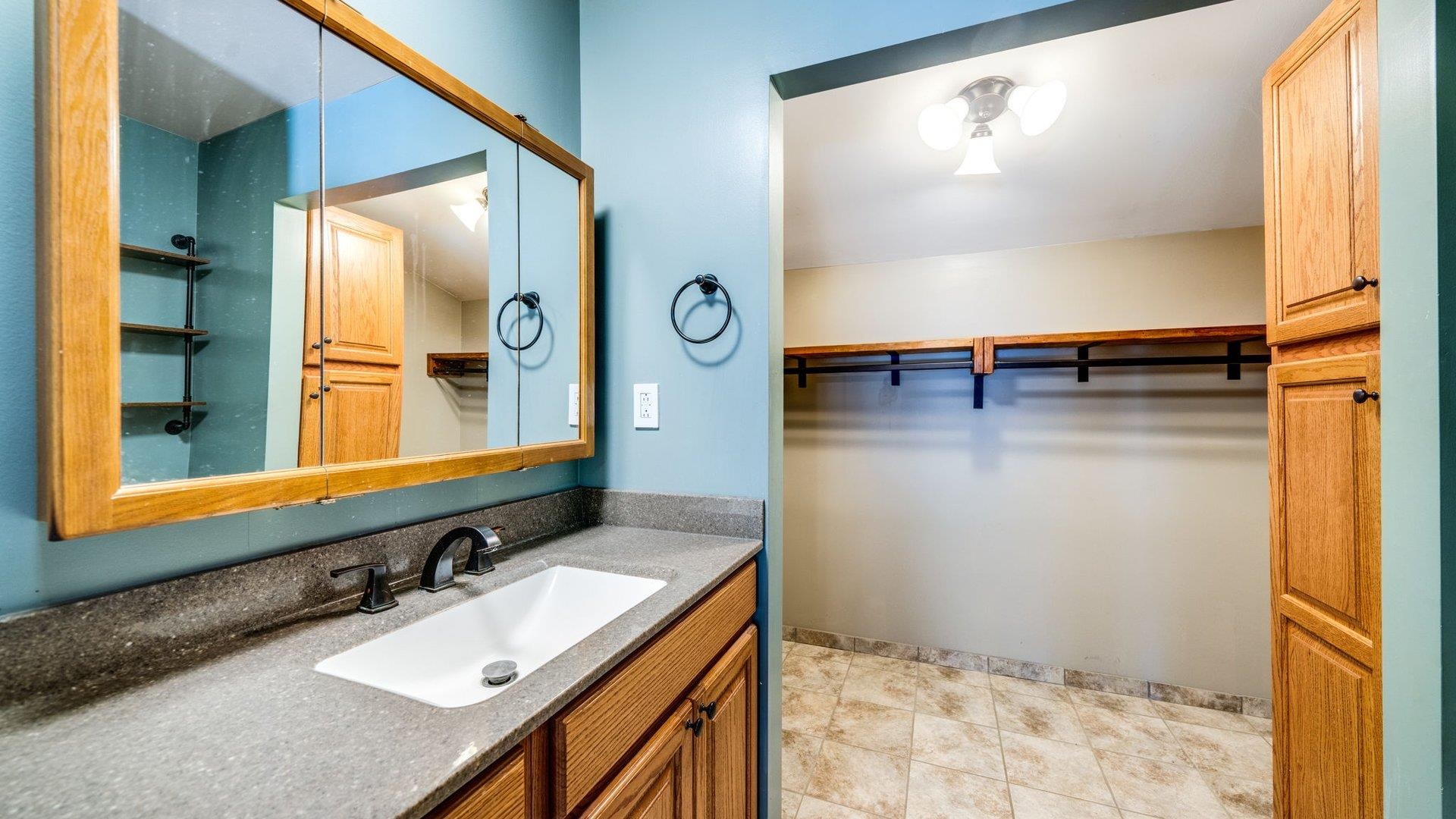 313 West Margaret Fuller Road Oregon, IL 61061 - Photo 18 of 46 a bathroom with a sink and a mirror